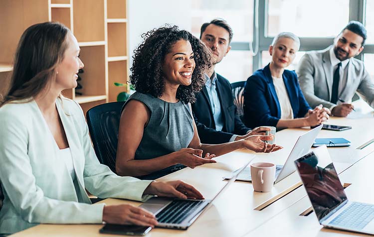 Woman discussing how much they are saving at their business meeting