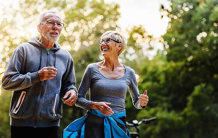 Senior adult couple jogging