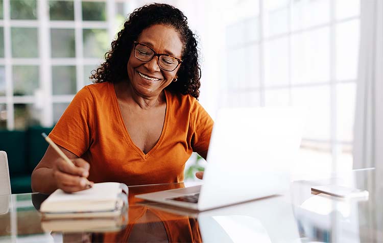 elder woman writing down a list