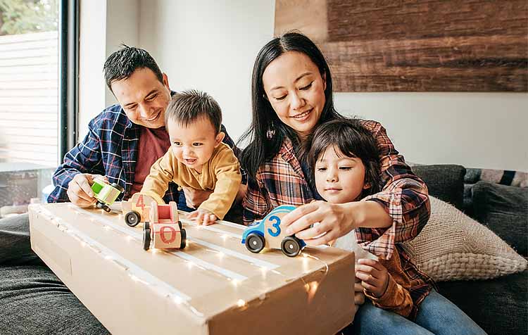 Parents playing with their young children