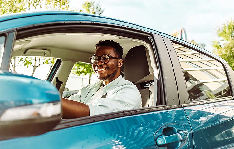 Man driving new car
