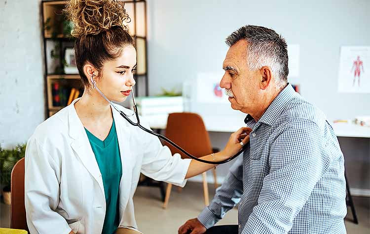 doctor listening to patient's heart