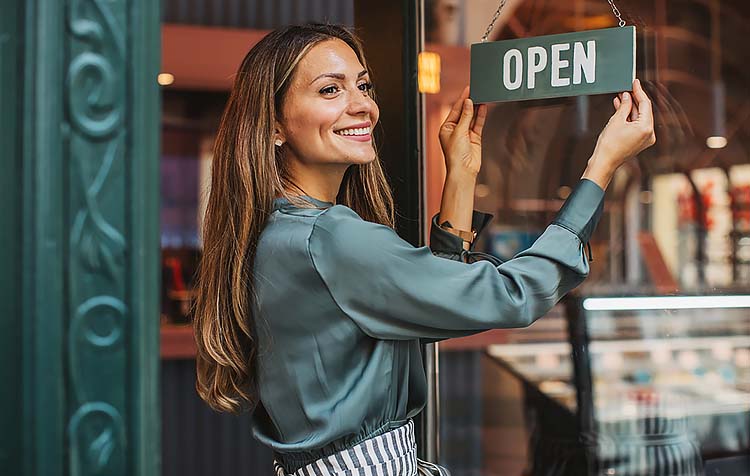 Small business owner opening her store for the day